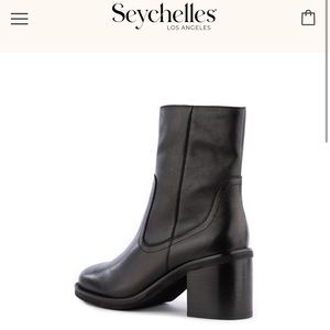 Seychelles high ankle boot. Very unique with the brown sole and black boot!